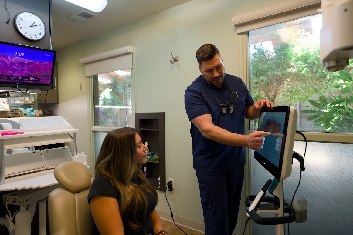 Dr. Barrero explaining a treatment plan with a patient